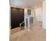 Well-lit staircase with modern black and white railings, leading to upper level at 4918 Preserve Pl, Firestone, CO 80504