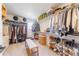 Large walk-in closet featuring ample shelving and storage space at 4918 Preserve Pl, Firestone, CO 80504