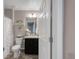 Well-lit bathroom with modern fixtures, vanity, and shower with decorative curtain at 6922 Vermillion St, Frederick, CO 80530