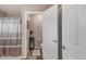 This bathroom offers a tub-shower combo and is decorated with neutral paint and accents at 6922 Vermillion St, Frederick, CO 80530