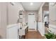Bright entry foyer featuring wood floors, decorative wall accents and an inviting entryway at 6922 Vermillion St, Frederick, CO 80530