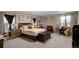 This primary bedroom is a tranquil retreat, featuring calming colors and comfortable furnishings at 6922 Vermillion St, Frederick, CO 80530