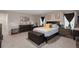 This primary bedroom is roomy, featuring calming colors, carpet, and comfortable furnishings at 6922 Vermillion St, Frederick, CO 80530