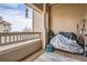 Private balcony features a wood deck and storage space at 8465 S Holland Way # 205, Littleton, CO 80128