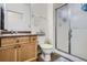 Clean bathroom with shower, toilet and wood vanity at 8465 S Holland Way # 205, Littleton, CO 80128