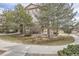 Townhouse exterior with landscaping and walkway at 8465 S Holland Way # 205, Littleton, CO 80128