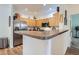 Modern kitchen with stainless steel appliances and wood cabinets at 8465 S Holland Way # 205, Littleton, CO 80128