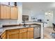 Kitchen boasts stainless steel dishwasher and a breakfast bar at 8465 S Holland Way # 205, Littleton, CO 80128