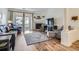Spacious living room with fireplace and hardwood floors at 8465 S Holland Way # 205, Littleton, CO 80128