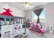 Bright bedroom features bunk beds, soft carpet, large windows and a ceiling fan at 9287 Twenty Mile Rd # 204, Parker, CO 80134