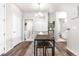 Well lit dining area features modern table and bench seats plus a whiteboard at 9287 Twenty Mile Rd # 204, Parker, CO 80134