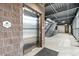 Hallway view with a stainless steel elevator and stairs leading to upper floors of the building at 9287 Twenty Mile Rd # 204, Parker, CO 80134