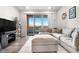Cozy living room with sliding glass doors to the patio providing natural light and space for relaxing at 9287 Twenty Mile Rd # 204, Parker, CO 80134