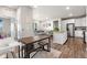 Open layout with living area, dining space, and kitchen, creating a perfect entertaining setting at 9287 Twenty Mile Rd # 204, Parker, CO 80134
