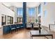 Inviting lobby area with modern furnishings, high ceilings, and natural light at 9287 Twenty Mile Rd # 204, Parker, CO 80134