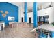 Spacious resident lounge with a cozy seating area, foosball table, and high ceilings at 9287 Twenty Mile Rd # 204, Parker, CO 80134