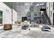 Inviting outdoor patio area with a fire pit, grill, seating and contemporary design elements at 9287 Twenty Mile Rd # 204, Parker, CO 80134