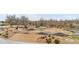 Scenic community playground area with bike ramps, walking paths, and seating at 9287 Twenty Mile Rd # 204, Parker, CO 80134