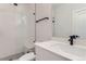 Modern bathroom featuring a glass-enclosed shower with white subway tile and black fixtures at 5575 Moosehead Cir, Longmont, CO 80503