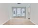 Bright dining room featuring a modern chandelier, hardwood floors, and large windows offering lots of natural light at 5575 Moosehead Cir, Longmont, CO 80503