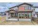 Attractive home exterior with modern color scheme, large windows, and stone accents at 5575 Moosehead Cir, Longmont, CO 80503