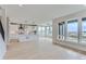Open-concept living space featuring a modern kitchen, breakfast nook, and natural light from large windows at 5575 Moosehead Cir, Longmont, CO 80503