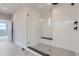 Walk-in shower with a glass enclosure and white tile at 5575 Moosehead Cir, Longmont, CO 80503