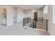Open staircase with modern railing leading to a bright, open living space at 5575 Moosehead Cir, Longmont, CO 80503