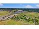 Scenic aerial view showcasing a community park with walking trails, open space, and nearby amenities at 142 S Fillmore Ave, Louisville, CO 80027