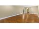 Large, finished basement area with hardwood floors, and convenient stairway access at 142 S Fillmore Ave, Louisville, CO 80027