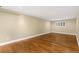 Spacious finished basement with hardwood floors, recessed lighting, and a window at 142 S Fillmore Ave, Louisville, CO 80027