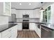 Stylish kitchen featuring stainless steel appliances, subway tile backsplash, and an undermount sink at 142 S Fillmore Ave, Louisville, CO 80027