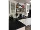 Well decorated kitchen with white cabinets, dark countertops, and stainless steel appliances at 142 S Fillmore Ave, Louisville, CO 80027