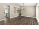 Open living area boasting hardwood floors, neutral walls, and a seamless transition to the kitchen at 142 S Fillmore Ave, Louisville, CO 80027