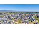 Breathtaking aerial view showcases a vibrant community with lake views and modern homes at 936 Sunflower St, Louisville, CO 80027