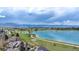Majestic aerial view of the area, capturing the serene lake and snow-capped mountain range backdrop at 936 Sunflower St, Louisville, CO 80027