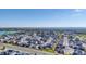 Extensive aerial view of homes surrounding a lake and sprawling greenery against a clear blue sky at 936 Sunflower St, Louisville, CO 80027