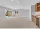 Finished basement with sliding doors to the backyard and a bar area at 936 Sunflower St, Louisville, CO 80027