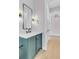 Stylish bathroom featuring modern vanity, sleek mirror, and elegant lighting fixtures at 936 Sunflower St, Louisville, CO 80027