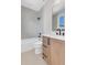 Modern bathroom with neutral colored tile and a tub shower at 936 Sunflower St, Louisville, CO 80027