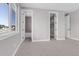 Neutral bedroom featuring two doorways and a window at 936 Sunflower St, Louisville, CO 80027