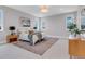 Bright, spacious bedroom featuring large windows, neutral tones, and carpet at 936 Sunflower St, Louisville, CO 80027