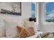 Bright bedroom featuring soft pillows, modern art and natural light streaming through the windows at 936 Sunflower St, Louisville, CO 80027