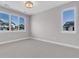 Bright bedroom with large windows and plush carpet flooring at 936 Sunflower St, Louisville, CO 80027