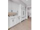 Kitchen with modern white cabinetry, countertops, stainless steel appliances, and sleek hardware at 936 Sunflower St, Louisville, CO 80027