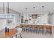 Spacious kitchen featuring bar seating, elegant pendant lights, and modern appliances at 936 Sunflower St, Louisville, CO 80027