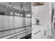 Modern kitchen with a Wolf oven in the island, white countertops, and sleek cabinetry at 936 Sunflower St, Louisville, CO 80027