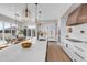 Bright kitchen with white cabinets, stainless appliances, large island, and breakfast nook at 936 Sunflower St, Louisville, CO 80027