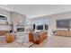 Bright living room with a modern fireplace, hardwood floors, and large windows at 936 Sunflower St, Louisville, CO 80027
