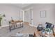 Cozy office space with modern desk, comfortable seating, and glass door entry at 936 Sunflower St, Louisville, CO 80027
